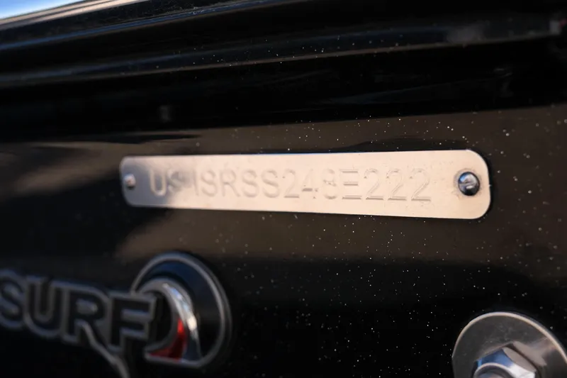 Slide: The Image of 2022 Supra SL boat with visible identification plate and "SURF" logo. - 8