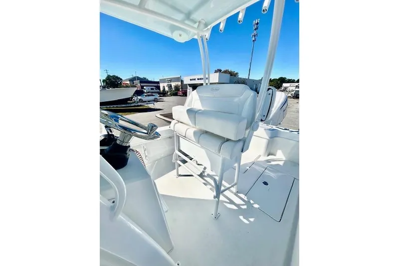 Slide: The Image of 2026 Pair Customs 24 Center Console DV Offshore boat interior with seating and steering wheel. - 17