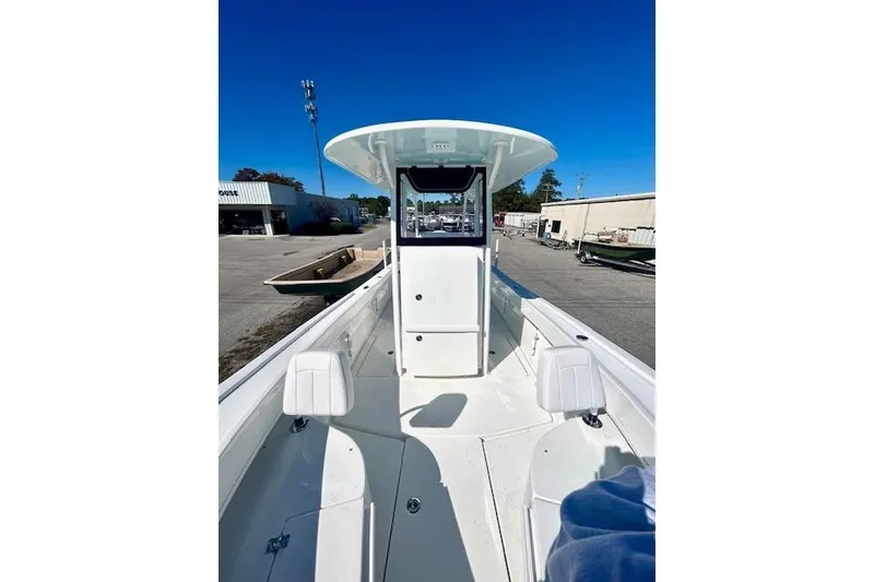Slide: The Image of 2026 Pair Customs 24 Center Console DV Offshore boat, white interior, outdoor setting. - 4