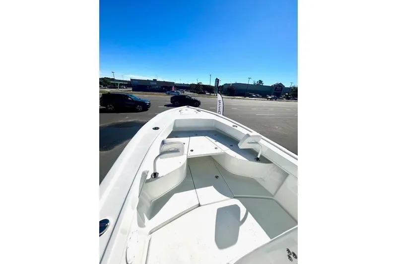Slide: The Image of 2026 Pair Customs 24 Center Console DV Offshore boat in parking lot, sunny day. - 6