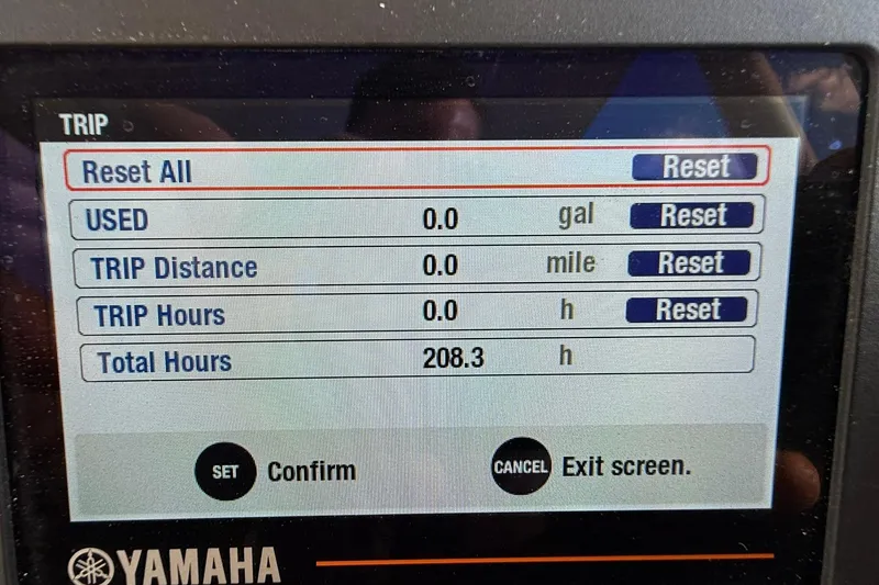 Slide: The Image of 2021 Pursuit C 238 Center Console boat with beige seating and fishing equipment. - 11