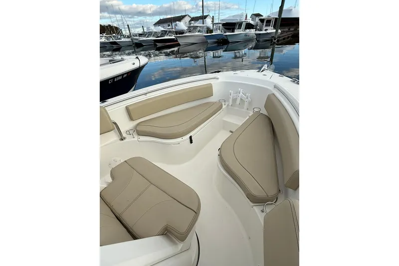 Slide: The Image of 2021 Pursuit C 238 Center Console dashboard with navigation and control systems. - 15