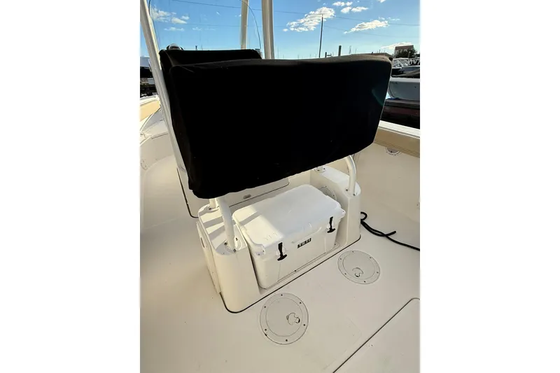 Slide: The Image of 2021 Pursuit C 238 Center Console boat docked under cloudy sky. - 6