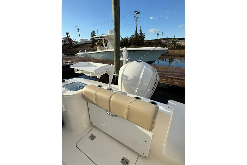 Slide: The Image of 2021 Pursuit C 238 Center Console boat docked at marina, rear view. - 7