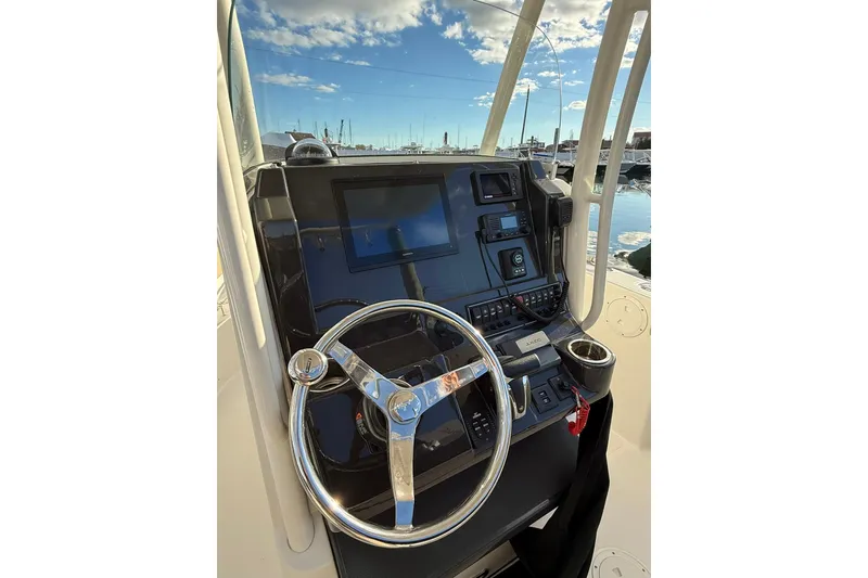 Slide: The Image of 2021 Pursuit C 238 Center Console boat interior with seating and storage. - 9