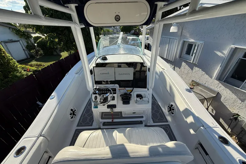 Slide: The Image of 2014 Sea Fox 256 Commander boat interior with Garmin navigation system and seating. - 12