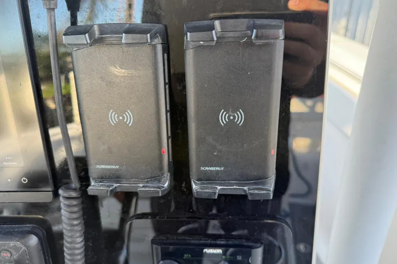 Slide: The Image of Dual Scanstrut wireless chargers on a 2014 Sea Fox 256 Commander boat dashboard. - 23