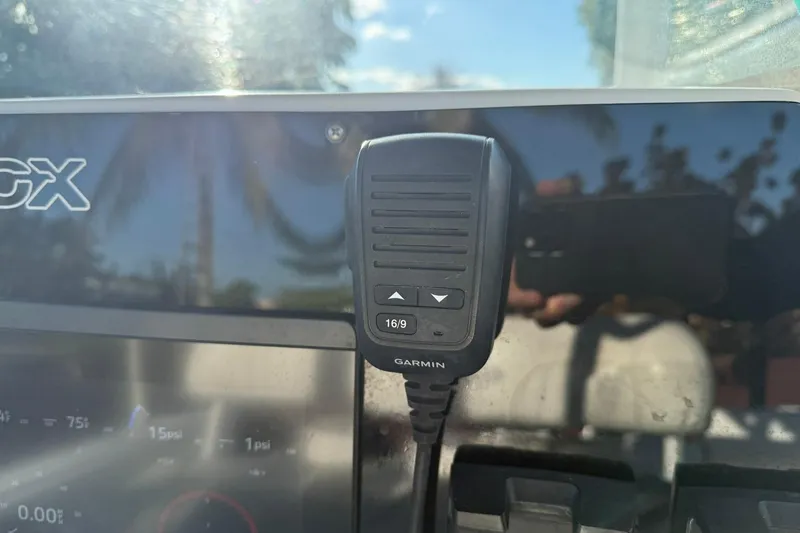 Slide: The Image of Garmin marine radio on 2014 Sea Fox 256 Commander dashboard, sunny day reflection. - 25