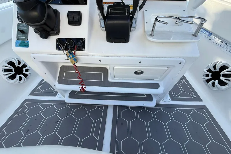 Slide: The Image of 2014 Sea Fox 256 Commander boat console with controls and speakers. - 28