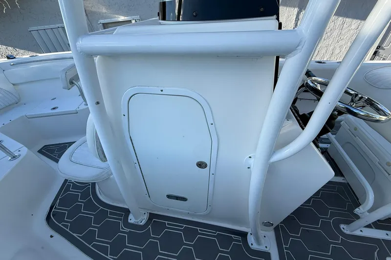 Slide: The Image of 2014 Sea Fox 256 Commander boat interior with steering wheel and seating. - 33