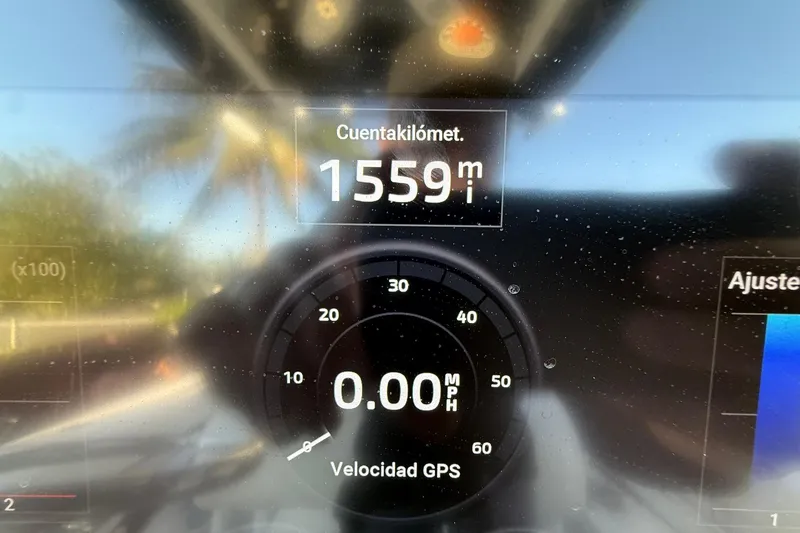 Slide: The Image of Dashboard display showing 1559 miles and 0.00 MPH on a Sea Fox 256 Commander. - 35