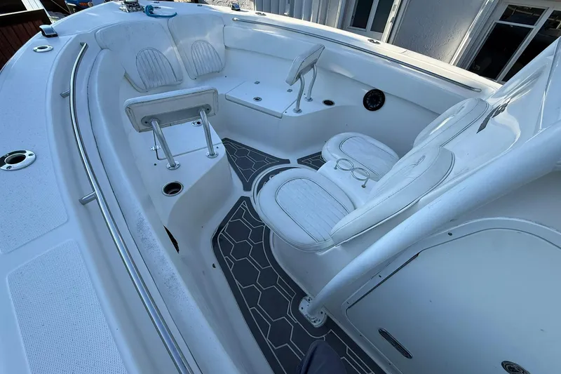 Slide: The Image of 2014 Sea Fox 256 Commander boat interior with white seating and modern design. - 36