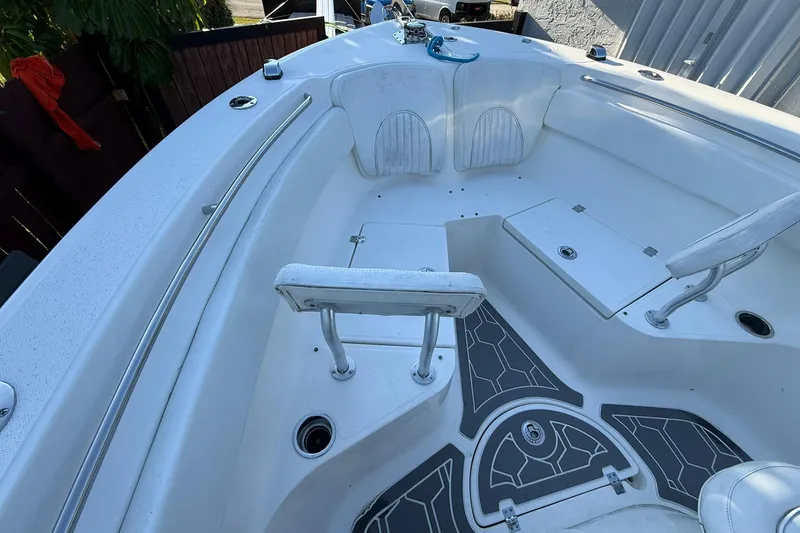 Slide: The Image of 2014 Sea Fox 256 Commander boat interior with seating and storage compartments. - 37