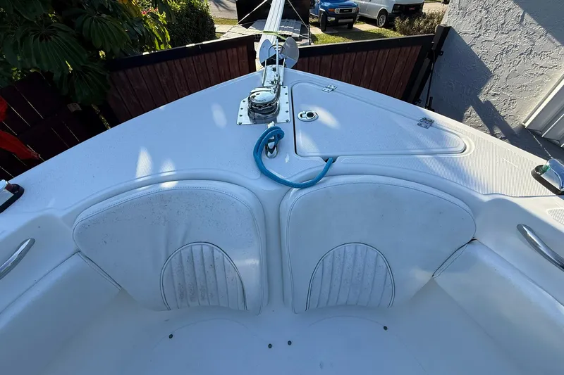 Slide: The Image of 2014 Sea Fox 256 Commander boat bow with seating and anchor, parked in driveway. - 38