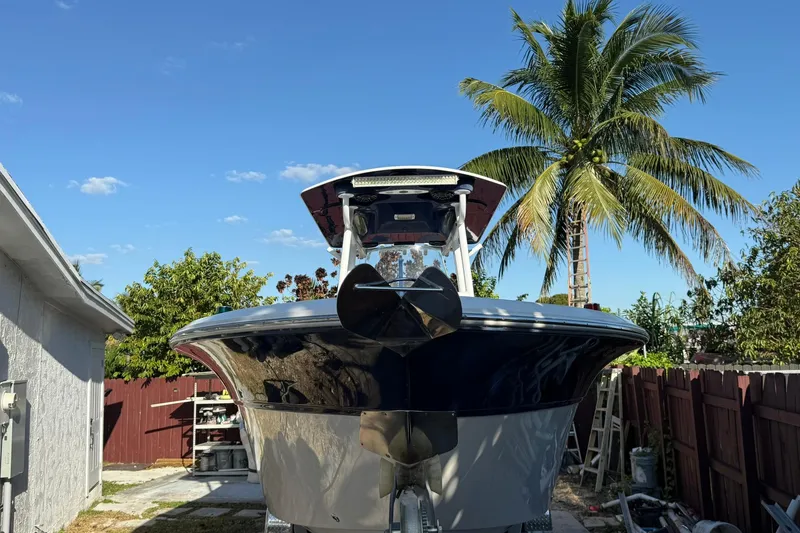 Slide: The Image of 2014 Sea Fox 256 Commander boat in a tropical setting with palm trees. - 4