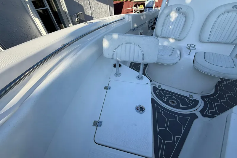 Slide: The Image of 2014 Sea Fox 256 Commander boat interior with seating and storage compartments. - 44