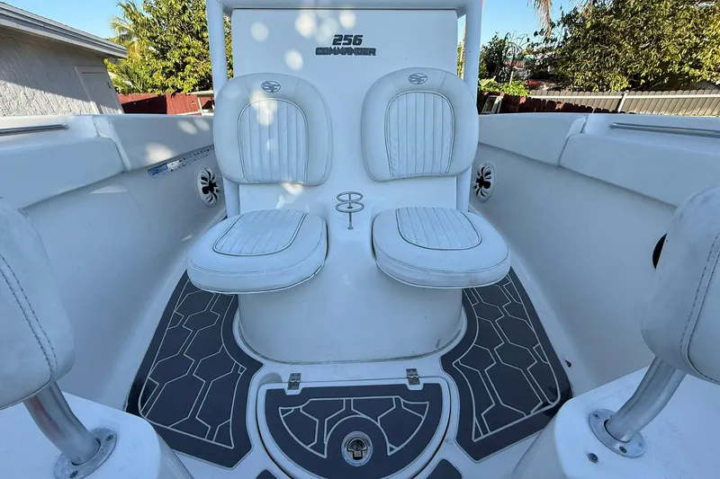 Slide: The Image of 2014 Sea Fox 256 Commander boat interior with dual white seats and stylish flooring. - 46
