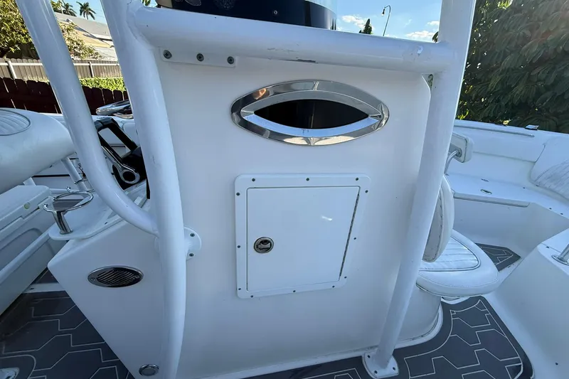 Slide: The Image of 2014 Sea Fox 256 Commander boat interior with white console and seating. - 52
