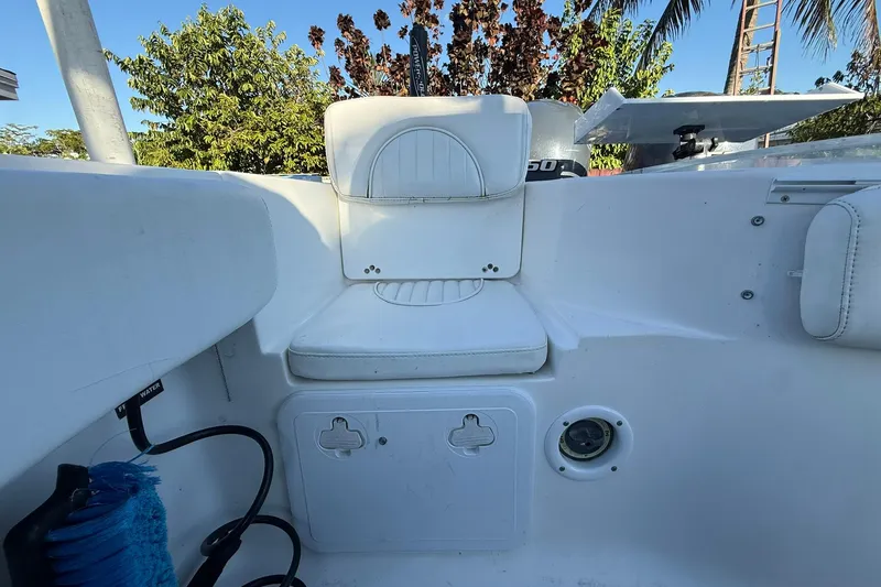 Slide: The Image of 2014 Sea Fox 256 Commander boat interior with seating and storage compartments. - 56