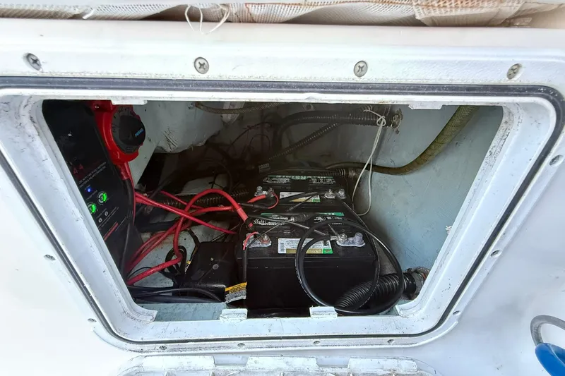 Slide: The Image of Battery compartment of a 2014 Sea Fox 256 Commander boat, showing wiring and connections. - 67