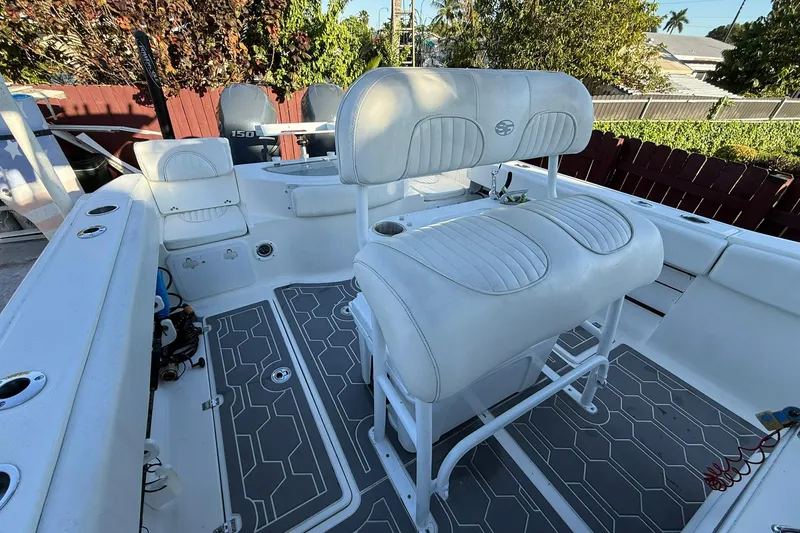 Slide: The Image of 2014 Sea Fox 256 Commander boat interior with white seating and modern design. - 69