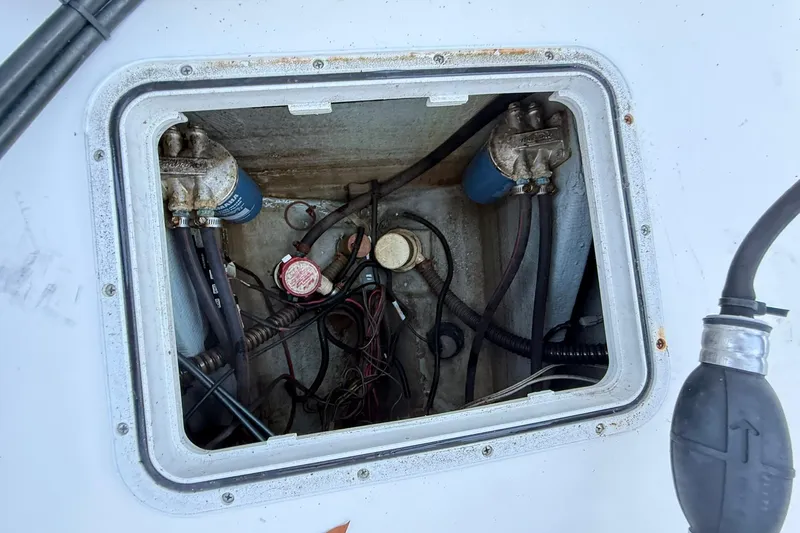 Slide: The Image of Open hatch of 2014 Sea Fox 256 Commander showing internal wiring and components. - 72