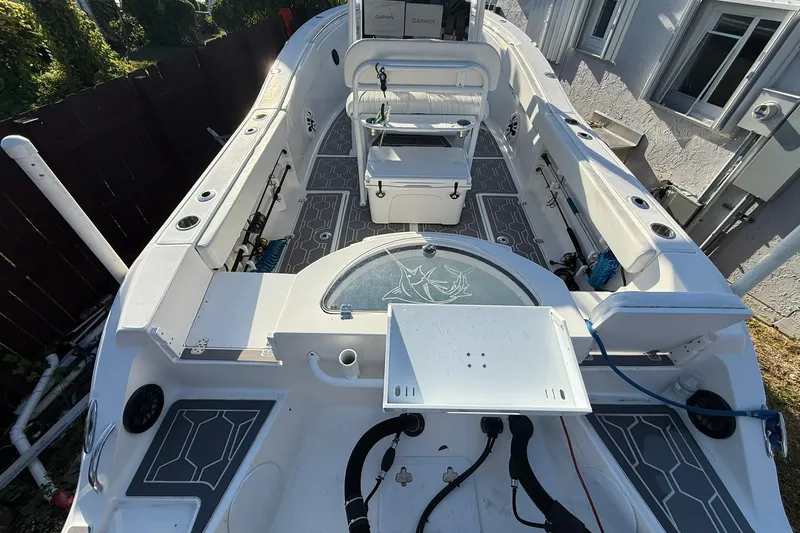 Slide: The Image of 2014 Sea Fox 256 Commander boat interior with seating and fishing equipment. - 8