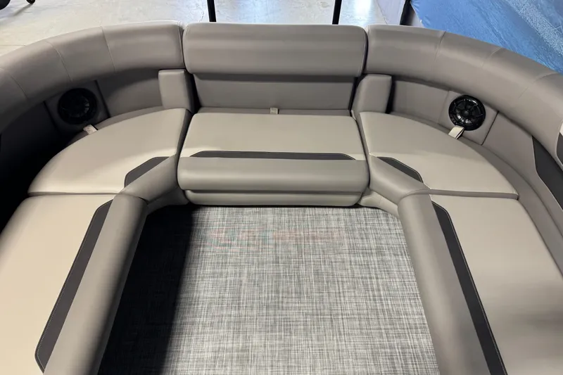 Slide: The Image of 2026 Premier 200 Sunscape RF boat interior with gray seating and integrated speakers. - 10