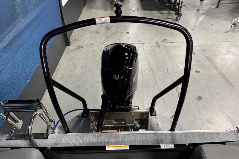 Slide: The Image of 2026 Premier 200 Sunscape RF boat engine and railing in a showroom. - 17