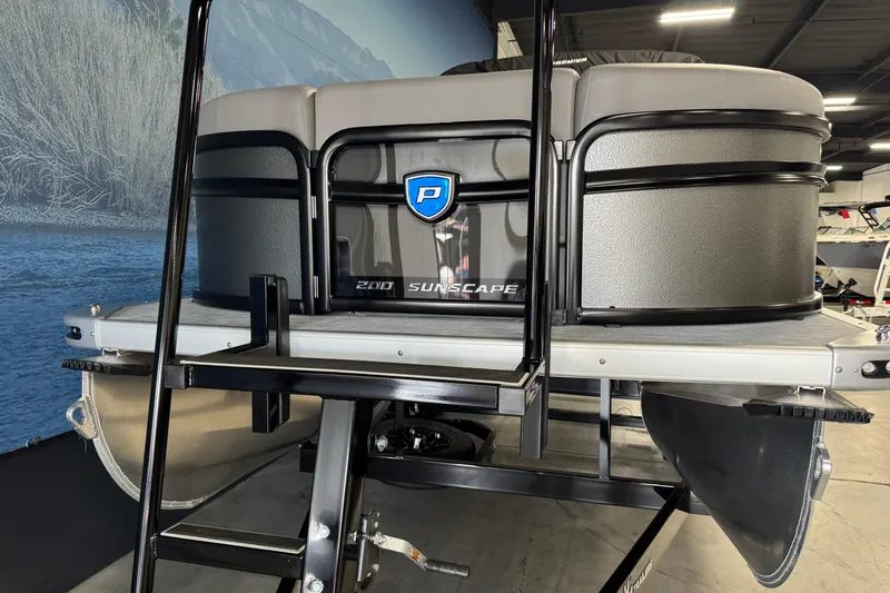 Slide: The Image of 2026 Premier 200 Sunscape RF pontoon boat in showroom, featuring sleek design and modern features. - 6