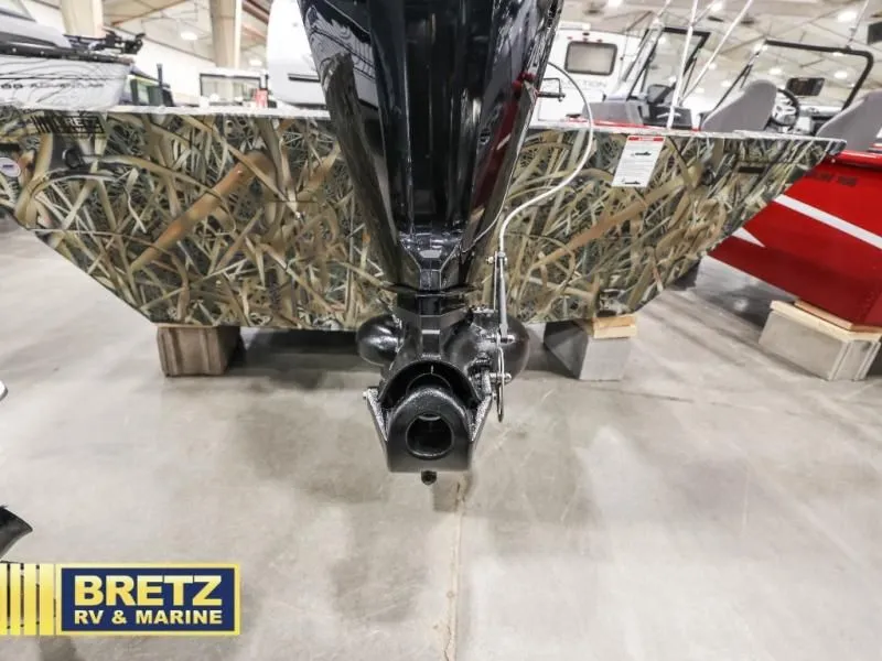 Slide: The Image of Sportsman 1866 T boat 2025 with camouflage design in showroom. - 11