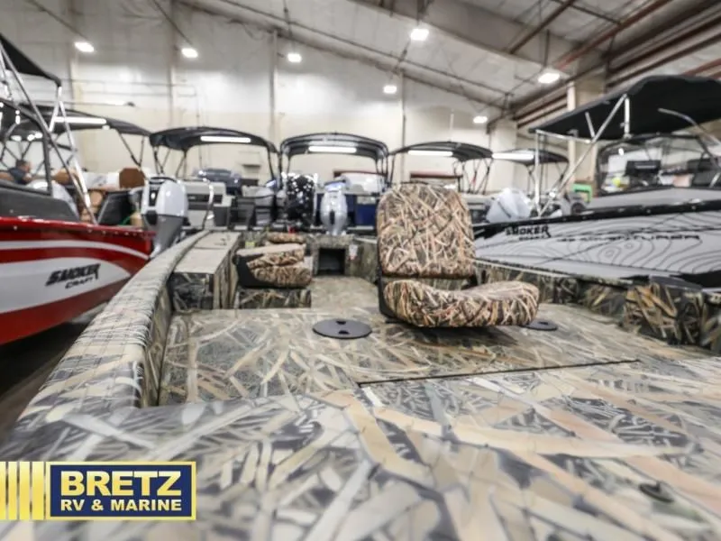 Slide: The Image of Sportsman 1866 T 2025 boat with camouflage pattern in showroom. - 8