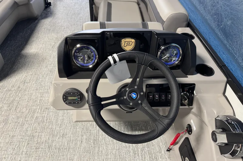 Slide: The Image of Steering console of 2026 Premier 220 Sunscape RF boat with modern controls and gauges. - 10