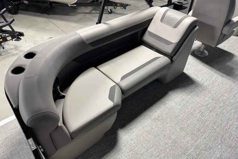 Slide: The Image of Luxurious seating on 2026 Premier 220 Sunscape RF boat, featuring sleek gray upholstery. - 12