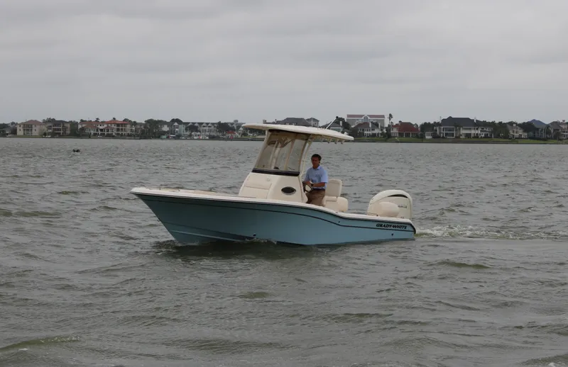 Slide: The Image of Grady-White 231 Coastal Explorer 2026 on calm waters. - 2