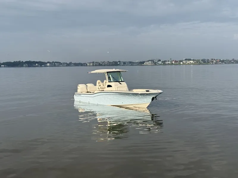 Slide: The Image of Grady-White 281 Coastal Explorer 2026 by the water. - 36
