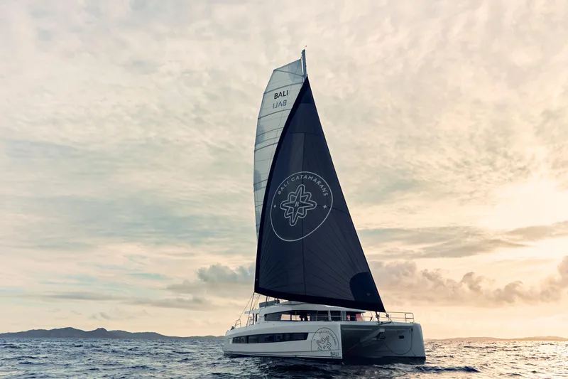The Image of Sailing catamaran Bali 5.8, 2026 model, cruising at sunset on open sea. - 0
