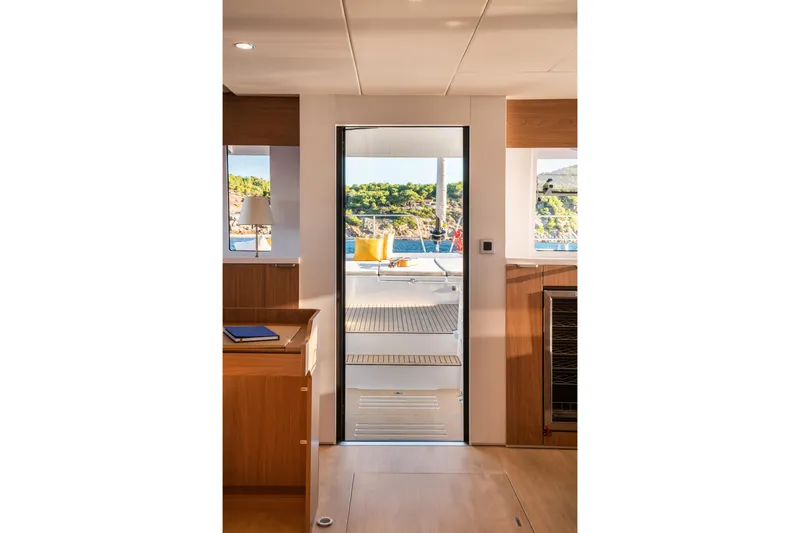 Slide: The Image of Interior view of 2026 Bali 5.8 yacht, showcasing elegant design and scenic ocean backdrop. - 12