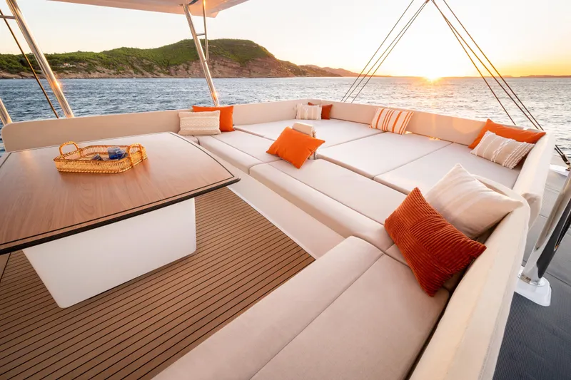 Slide: The Image of Luxurious Bali 5.8 yacht deck with cozy seating, sunset view, 2026 model. - 19