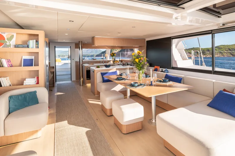 Slide: The Image of Luxurious interior of 2026 Bali 5.8 yacht with elegant dining area and ocean view. - 2
