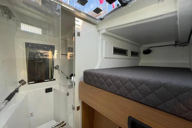 Slide: The Image of Interior of 2026 Bali 5.8 yacht cabin with bed and shower area. - 28