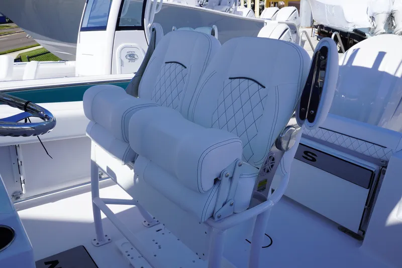 Slide: The Image of 2026 Sportsman Open 232 Center Console boat with luxurious seating and modern design. - 9