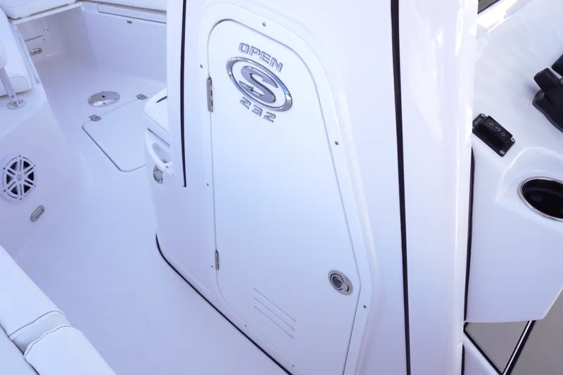 Slide: The Image of 2026 Sportsman Open 232 Center Console interior, featuring sleek white design and modern amenities. - 21