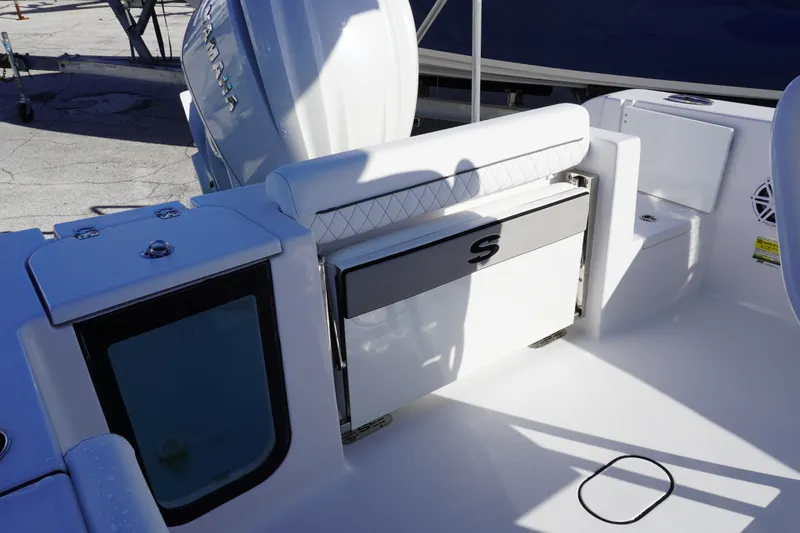 Slide: The Image of 2026 Sportsman Open 232 Center Console boat interior with seating and storage. - 4