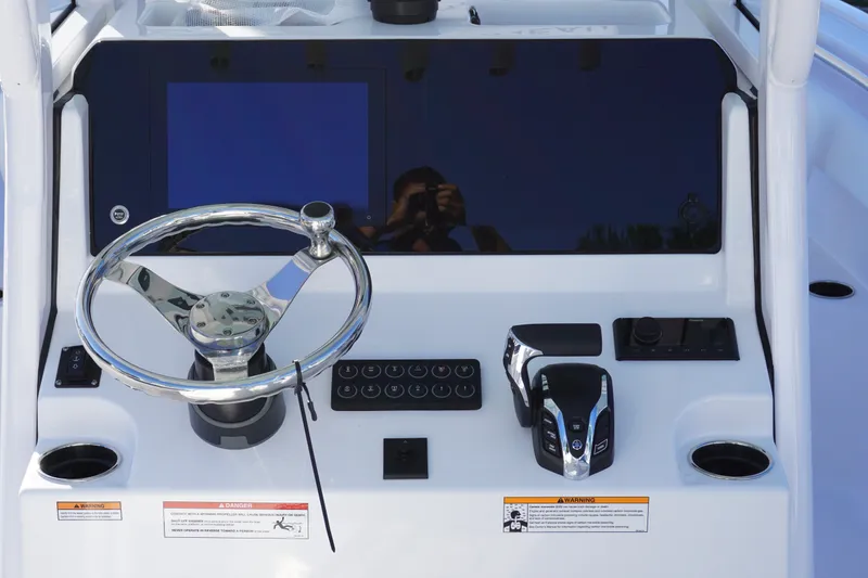 Slide: The Image of 2026 Sportsman Open 232 Center Console dashboard with steering wheel and controls. - 11