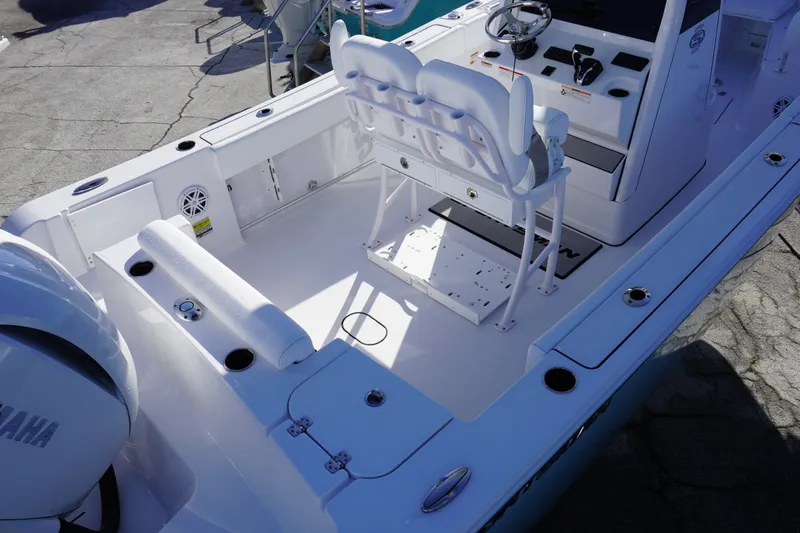 Slide: The Image of 2026 Sportsman Open 232 Center Console boat interior with seating and steering wheel. - 3