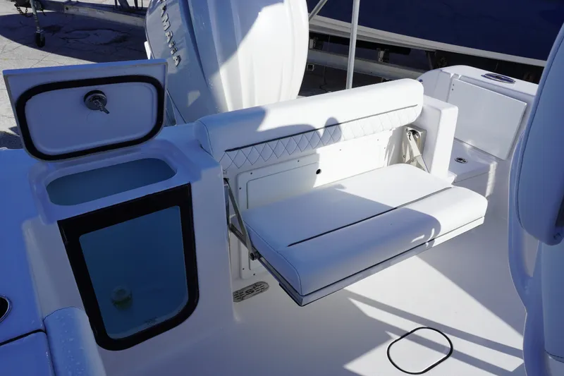 Slide: The Image of 2026 Sportsman Open 232 Center Console boat interior with seating and storage compartments. - 5