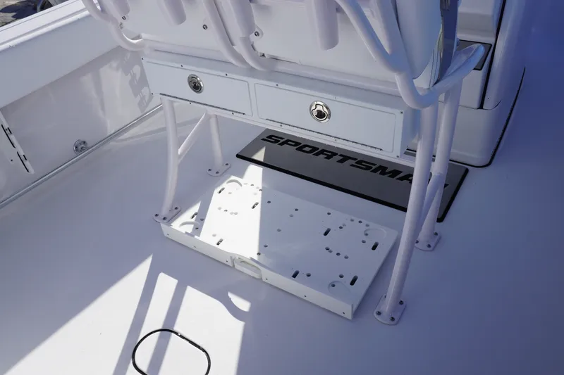 Slide: The Image of 2026 Sportsman Open 232 Center Console boat interior with storage compartments. - 6