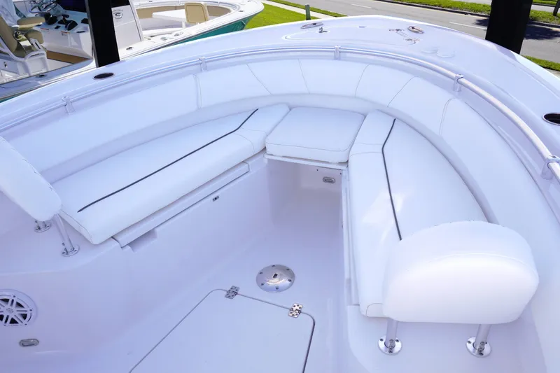 Slide: The Image of 2026 Sportsman Open 232 Center Console boat interior with white seating and sleek design. - 18