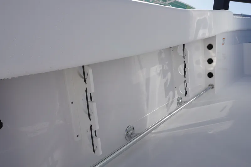 Slide: The Image of 2026 Sportsman Open 232 Center Console interior detail with rod holders and sleek design. - 14
